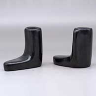 A pair of black candlestick holders, click or tap to see a larger version