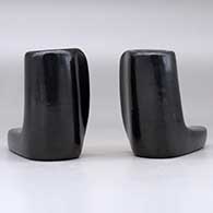 A pair of black candlestick holders, click or tap to see a larger version