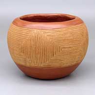 A Potsuwii-style bowl with a hexagonal opening and a sgraffito-with-micaceous clay fine line rock art design around the shoulder
 by Tomasita Reyes Montoya of Ohkay Owingeh
