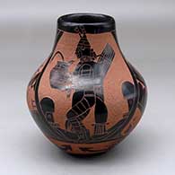 A black jar decorated with a sgraffito pueblo dancer, feather and geometric design
 by Tom Tapia of Ohkay Owingeh