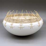 A micaceous white bowl with a basketweave rim
 by Jacquie Stevens of Winnebago