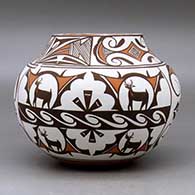 A polychrome jar decorated with a four panel deer in his house, rainbird, fineline and geometric design, click or tap to see a larger version