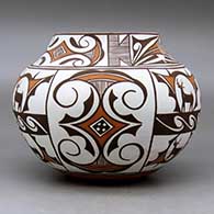 A polychrome jar decorated with a four panel deer in his house, rainbird, fineline and geometric design, click or tap to see a larger version