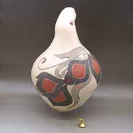 A large, lidded sculptural piece decorated with a lightly carved, sgraffito and painted flower, serpent and geometric design, click or tap to see a larger version