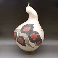 A large, lidded sculptural piece decorated with a lightly carved, sgraffito and painted flower, serpent and geometric design
 by Diego Valles of Mata Ortiz and Casas Grandes