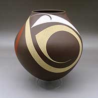 A large polychrome jar decorated with a three panel tiny square, sickle and flowing geometric design
 by Diego Valles of Mata Ortiz and Casas Grandes