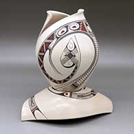 A polychrome jar with a cut geometric opening and decorated with a two-panel Paquime-style flowing geometric design with a matching custom stand
 by Diego Valles of Mata Ortiz and Casas Grandes