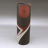 A tall polychrome cylinder decorated with a spiral and fineline flowing geometric design
 by Diego Valles of Mata Ortiz and Casas Grandes