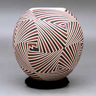 A polychrome jar decorated with a four panel geometric design, click or tap to see a larger version