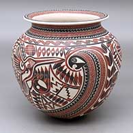A polychrome jar with a rolled lip and decorated with a slipped and sgraffito serpent, hummingbird, lizard and geometric design
 by Martin Olivas of Mata Ortiz and Casas Grandes