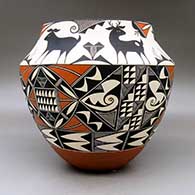 A large polychrome jar decorated with a three panel geometric design below the shoulder and a six panel deer and geometric design above the shoulder, click or tap to see a larger version