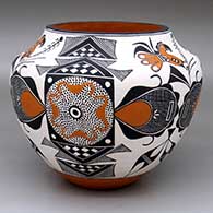 A polychrome jar decorated with a three-panel parrot, hachure, fine line and geometric design
 by Florence Aragon of Acoma