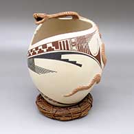 Polychrome jar with a geometric cut opening, an applique rattlesnake detail, and a painted geometric design
 by Moroni Quezada of Mata Ortiz and Casas Grandes