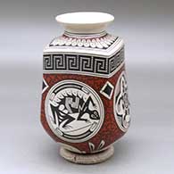 A squarish polychrome jar with a rolled lip and decorated with a medallion, lizard, turtle, rabbit and geometric design
 by Luis Martinez of Mata Ortiz and Casas Grandes