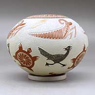 A polychrome jar decorated with a lightly carved, sgraffito and painted turtle, roadrunner, grasshopper, lightning bolt and geometric design, click or tap to see a larger version