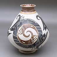 A polychrome jar with a recurved lip and decorated with a sgraffito, lightly carved and painted three panel grasshopper, serpent, lizard and geometric design
 by Eduardo Quintana of Mata Ortiz and Casas Grandes