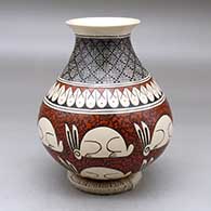 A polychrome jar with an everted neck and decorated with a rabbit, fineline and geometric design
 by Nancy Heras of Mata Ortiz and Casas Grandes