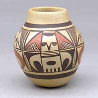 A small polychrome jar decorated with a four panel kachina, crosshatching and geometric design
 by Fannie Nampeyo of Hopi