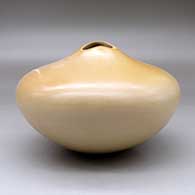 A buff seed jar with an organic opening, an ear of corn applique and her matte Breath of Life design, click or tap to see a larger version