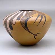 A high shouldered polychrome jar decorated with a bird element, feather and geometric design, click or tap to see a larger version