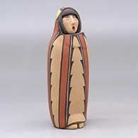 A polychrome Singing Mother wearing a manta decorated with a geometric design, click or tap to see a larger version