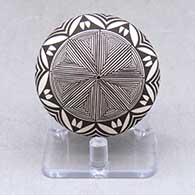 A black on white seed pot decorated with a snowflake fineline and geometric design
 by Sharon Lewis of Acoma