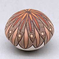A miniature polychrome seed pot decorated with a fineline and geometric design
 by Diane Lewis of Acoma