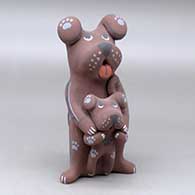 A polychrome canine storyteller with a pup
 by Darrick Tsosie of Jemez