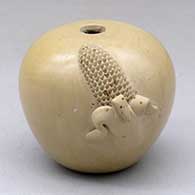 A small buff seed pot decorated with an ear of corn applique
 by Iris Nampeyo of Hopi