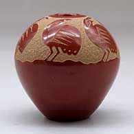 A red seed pot decorated above the shoulder with a sgraffito family of quail, click or tap to see a larger version