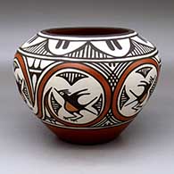 A polychrome high-shoulder jar decorated with a six-panel roadrunner, rainbow and geometric design
 by Ruby Panana of Zia