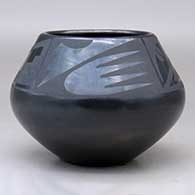 A black on black bowl decorated above the shoulder with a four-panel bat wing, kiva step and geometric design, click or tap to see a larger version