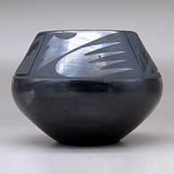 A black on black bowl decorated above the shoulder with a four-panel bat wing, kiva step and geometric design, click or tap to see a larger version