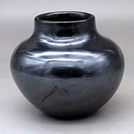 A plain, polished black jar with fire clouds
 by Maria Martinez of San Ildefonso