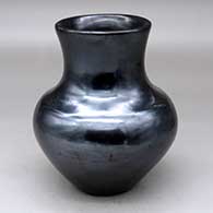 A plain polished black vase
 by Maria Martinez of San Ildefonso