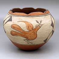 A polychrome jar with a scalloped rim and decorated with a three-panel roadrunner and geometric design
 by Unknown of Zia