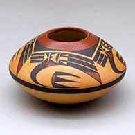 A small polychrome jar decorated above the shoulder with a four-panel bird element and geometric design
 by Steve Lucas of Hopi