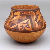 A black-on-mixed-clay jar decorated with a four-panel cloud pattern, fine line and geometric design
 by Calvin Analla Jr of Laguna