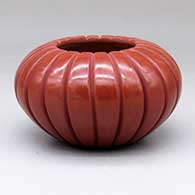 A red melon jar carved with 20 ribs
 by Anita Suazo of Santa Clara