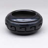 A small black bowl carved with a band of geometric design around the shoulder
 by Nathan Youngblood of Santa Clara