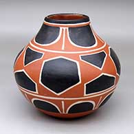 A polychrome jar decorated with a four-panel geometric design
 by Robert Tenorio of Santo Domingo