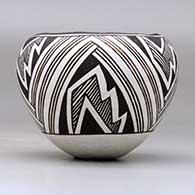 A small black on white jar decorated with a three panel fineline, lightning bolt and geometric design, click or tap to see a larger version