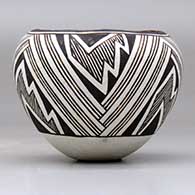 A small black on white jar decorated with a three panel fineline, lightning bolt and geometric design, click or tap to see a larger version