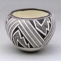 Click for a larger view A small black on white jar decorated with a three panel fineline, lightning bolt and geometric design
by Lucy Lewis of Acoma