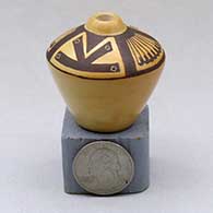 Click for a larger view A miniature black on yellow high shouldered jar decorated above the shoulder with a four panel feather and geometric design
by Les Namingha of Hopi