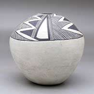 A black on white seed pot decorated with a four-panel fineline, lightning bolt and geometric design above the shoulder, click or tap to see a larger version