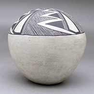 A black on white seed pot decorated with a four-panel fineline, lightning bolt and geometric design above the shoulder, click or tap to see a larger version