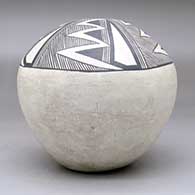 A black on white seed pot decorated with a four-panel fineline, lightning bolt and geometric design above the shoulder, click or tap to see a larger version