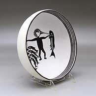 A black on white bowl decorated inside with a Mimbres replica of the Fisherman design, click or tap to see a larger version