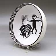 A black on white bowl decorated inside with a Mimbres replica of the Fisherman design, click or tap to see a larger version
